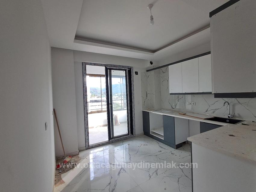 Brandneue 2+1 Wohnung Zum Verkauf In Ortaca Karaburun Mit Geschlossener Küche