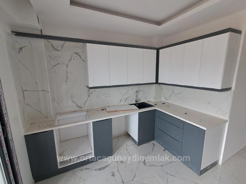 Brandneue 2+1 Wohnung Zum Verkauf In Ortaca Karaburun Mit Geschlossener Küche