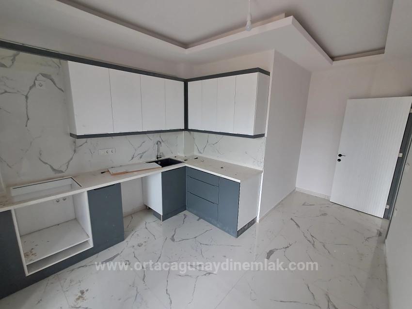 Brandneue 2+1 Wohnung Zum Verkauf In Ortaca Karaburun Mit Geschlossener Küche