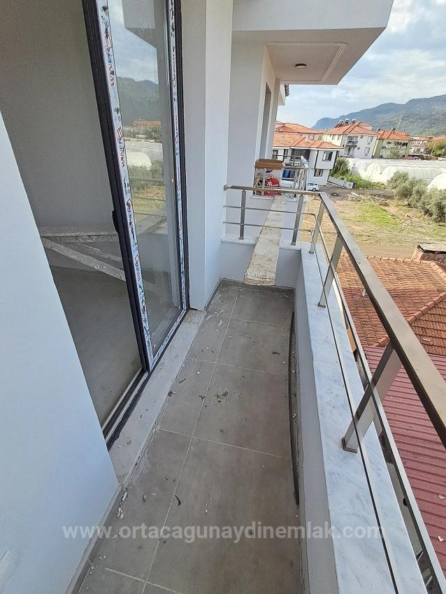 Brandneue 2+1 Wohnung Zum Verkauf In Ortaca Karaburun Mit Geschlossener Küche