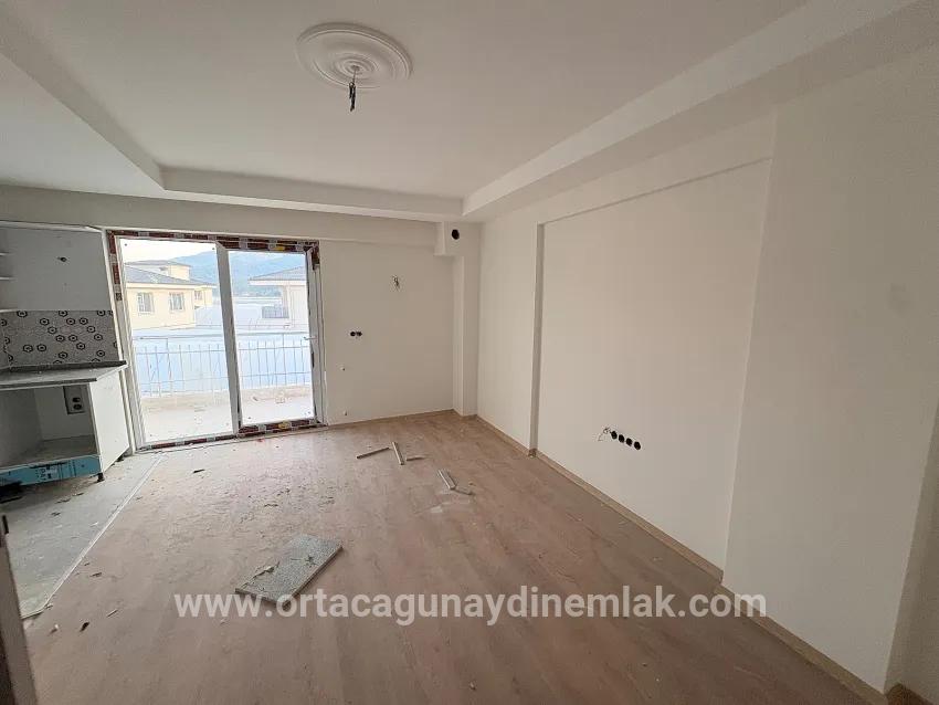Großzügige 1+1-wohnung Zum Verkauf Im Stadtteil Ortaca Karaburun.