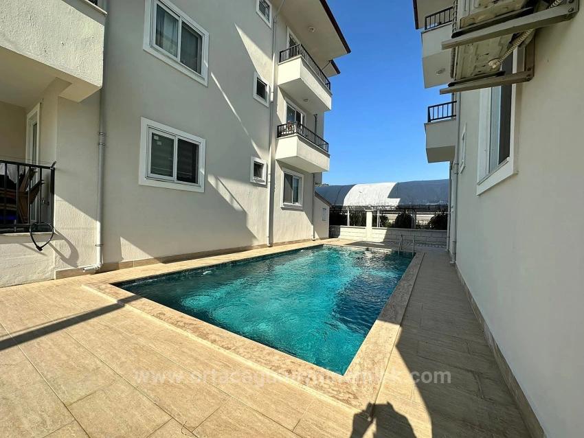 3+1 Möblierte Wohnung Zum Verkauf In Ortaca Karaburun Mit Swimmingpool