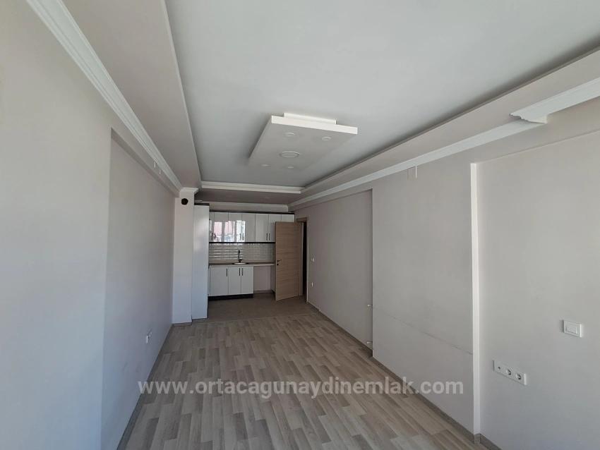 Günaydın Real Estate Bietet Eine Geräumige 1+1-Wohnung Im Stadtzentrum Zum Verkauf An.