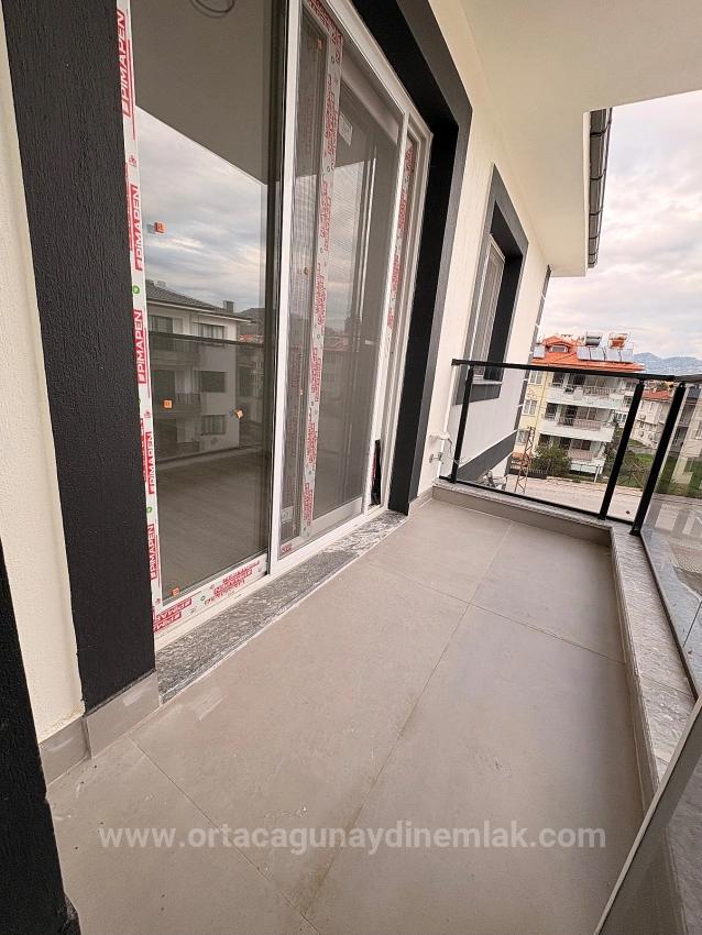 2+1 Brandneue Wohnung Mit Geschlossener Küche Zum Verkauf Im Stadtteil Arıkbaşı, Ortanca, Muğla.