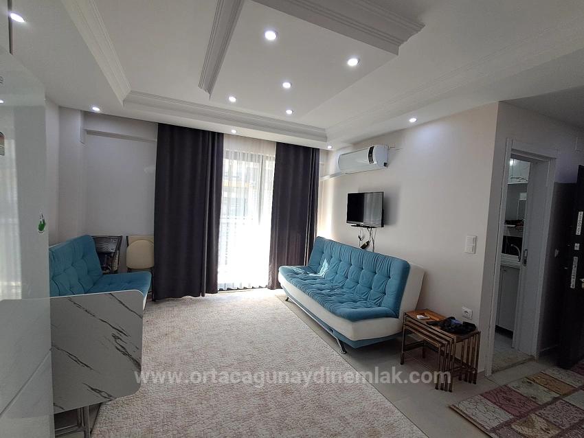 1+1 Furnished Apartment For Sale With Tourism Operation Certificate In Ortaca Karaburun