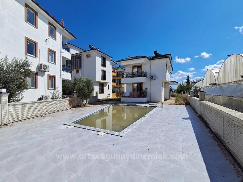 1+1 Brand New Apartment For Sale With Swimming Pool In Ortaca Karaburun