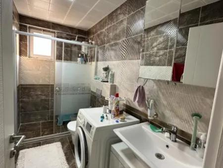 Ortaca Bahçelievler Mahallesi Kaloriferli 3 1 Closed Kitchen Apartment For Sale.