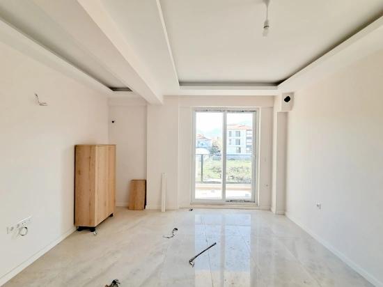 Продается Новая Квартира 2+1 С Бассейном В Районе Ортаджа Чайлы.