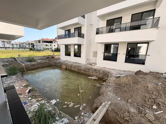 В Ortaca Bahçelievler 2+1 Закрытая Кухня С Бассейном Квартира На Продажу