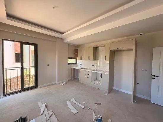 Ortaca Karaburun'da Satılık 1+1 Daire - Havuzlu Site