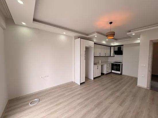 Ortaca Çaylı da kiralık 1+1 daire, havuzlu sitede, ankastre setli
