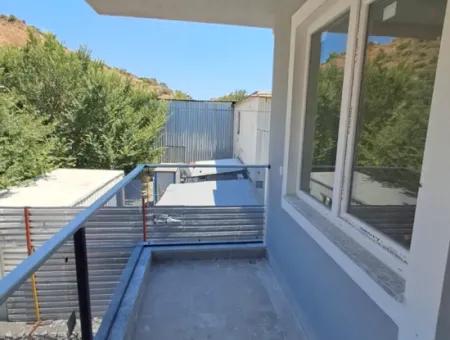 Günaydın Emlak'tan Ortaca Yerbelende Havuzlu 1+1 Satılık Daire