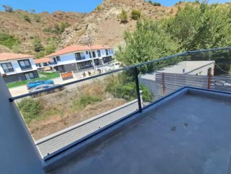 Günaydın Emlak'tan Ortaca Yerbelende Havuzlu 1+1 Satılık Daire
